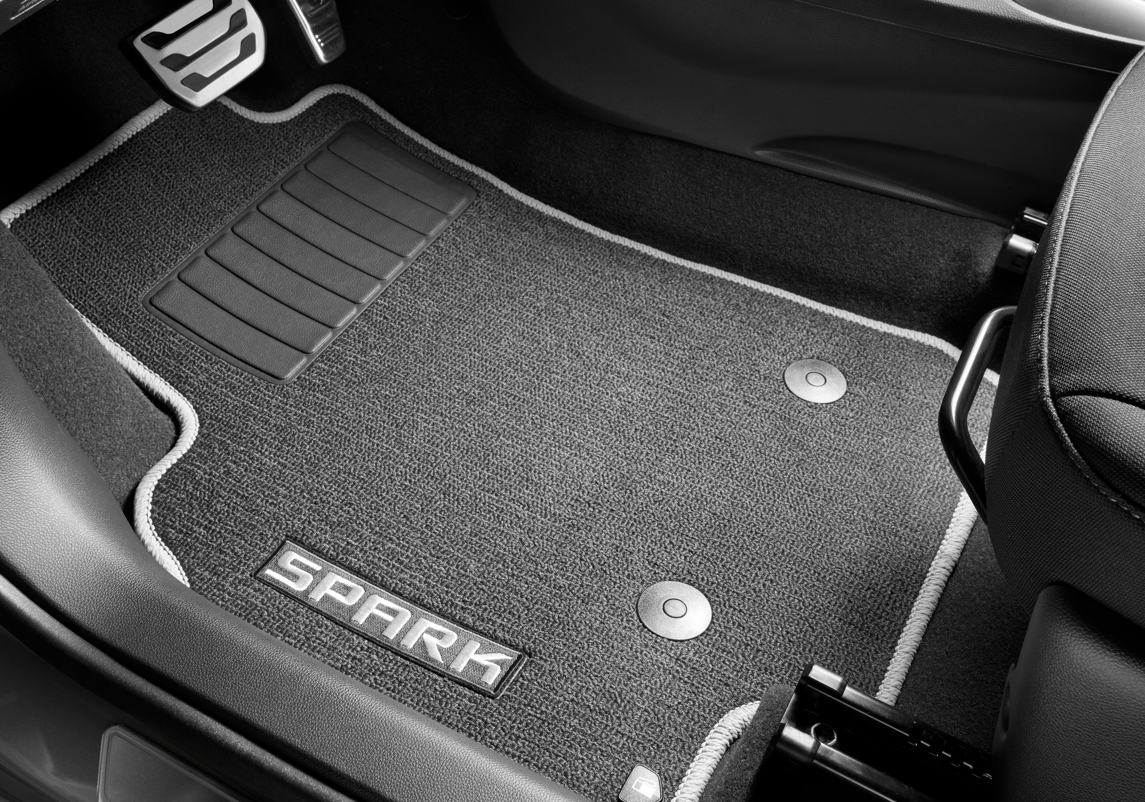 First- and Second-Row Premium Carpeted Floor Mats in Jet Black with Titanium Stitching and Spark Script