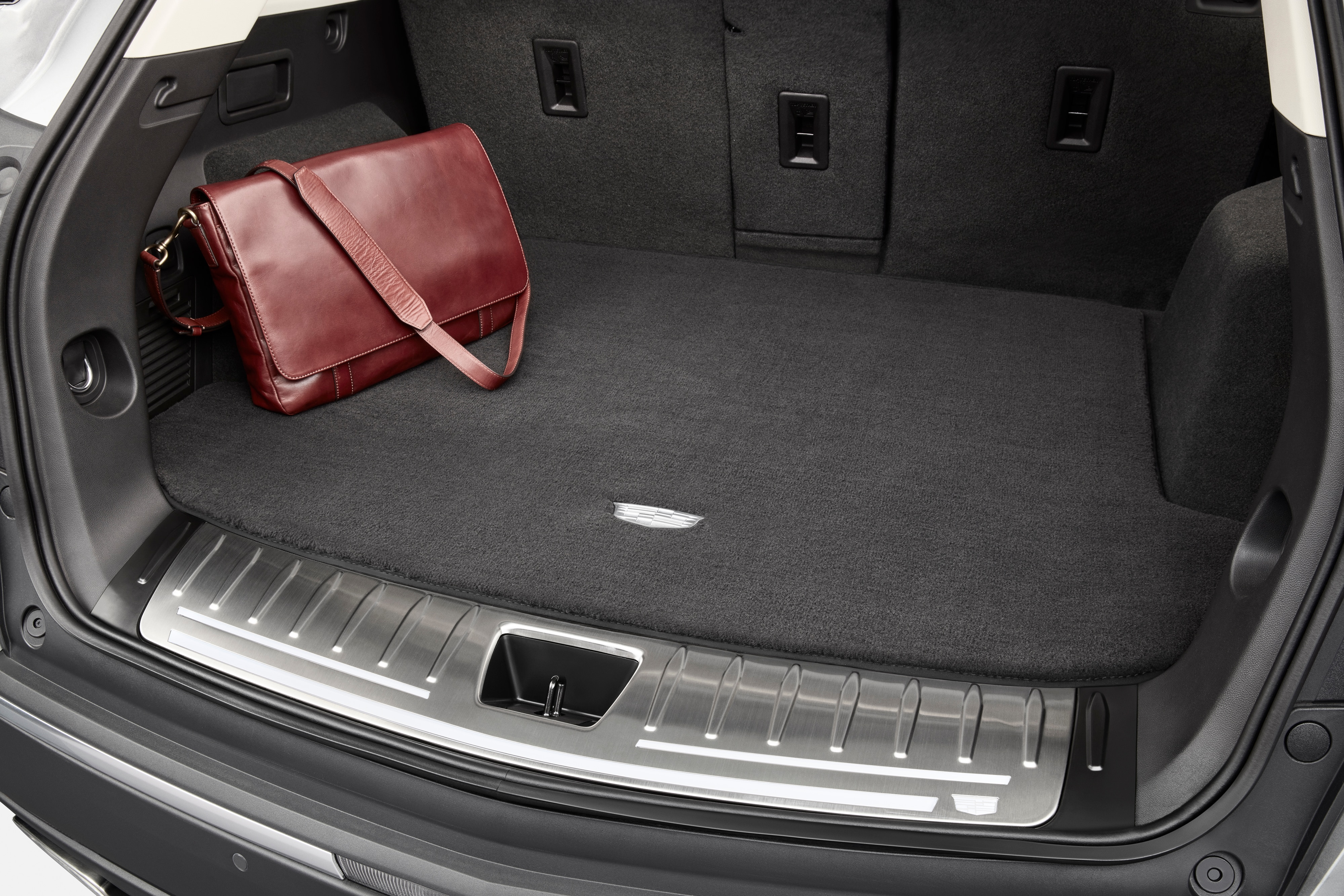 Premium Carpeted Cargo Area Mat in Jet Black with Cadillac Logo