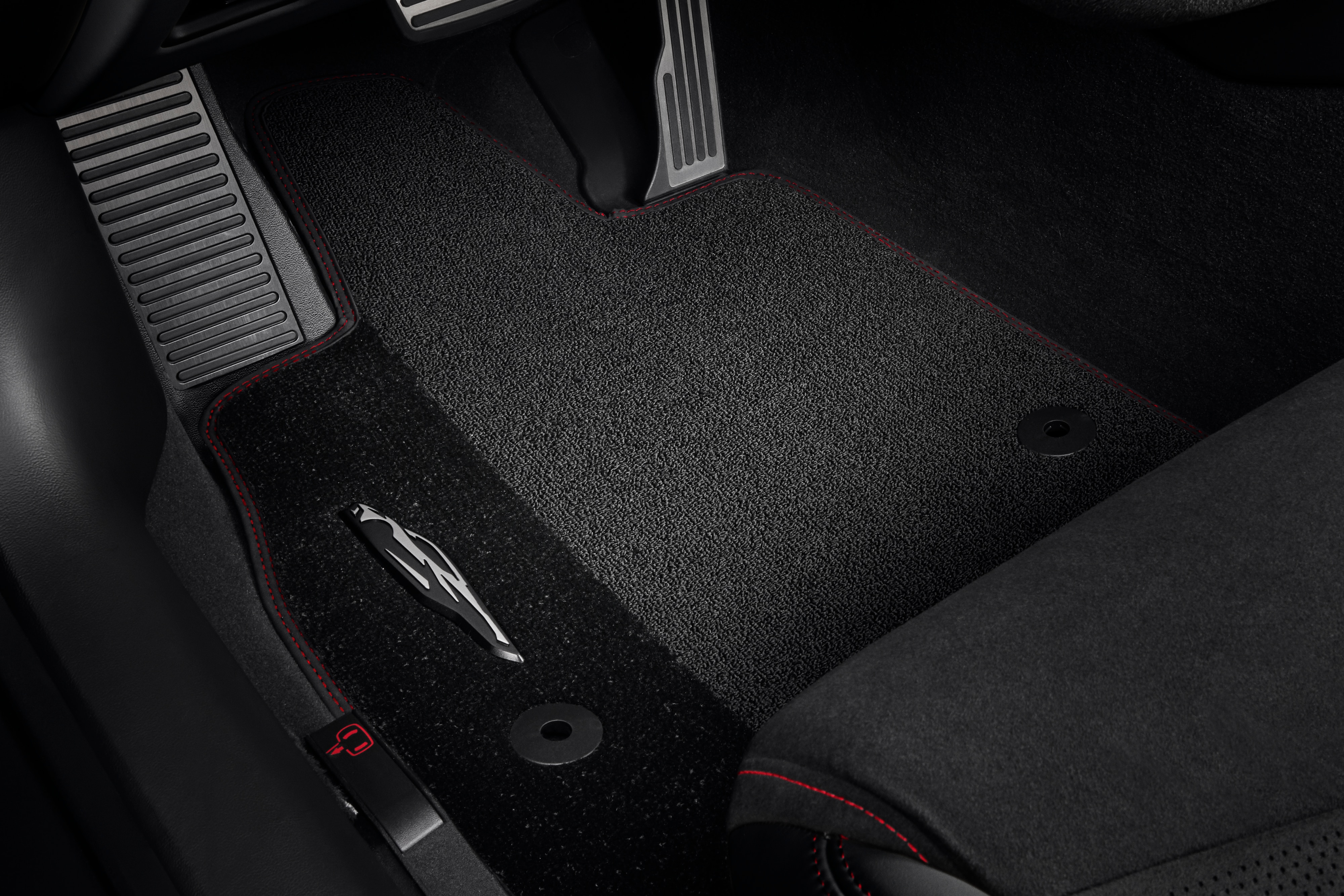 First-Row Premium Carpeted Floor Mats in Jet Black with Torch Red Stitching and Corvette Silhouette