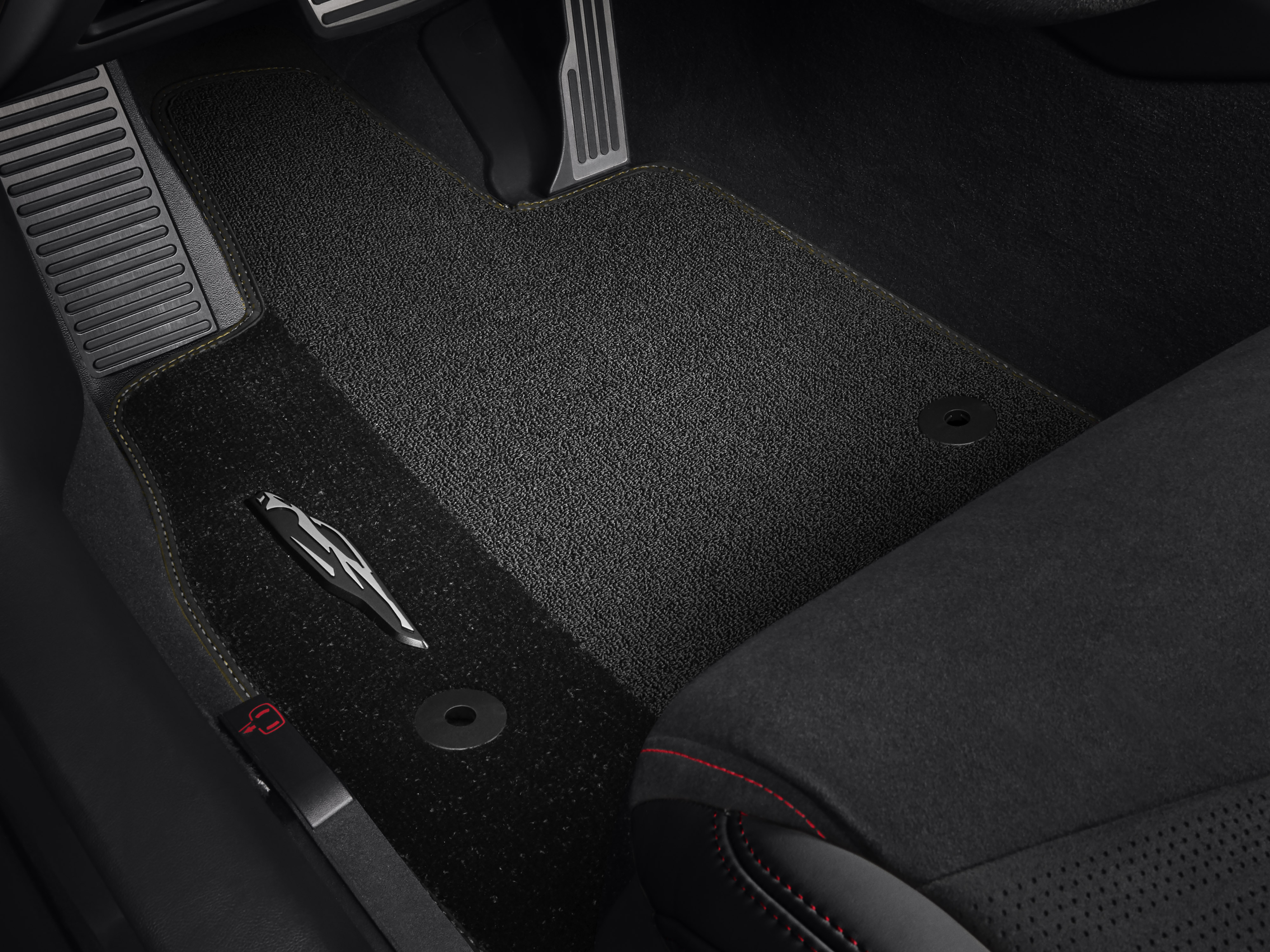 First-Row Premium Carpeted Floor Mats in Jet Black with Natural Tan Stitching and Corvette Silhouette