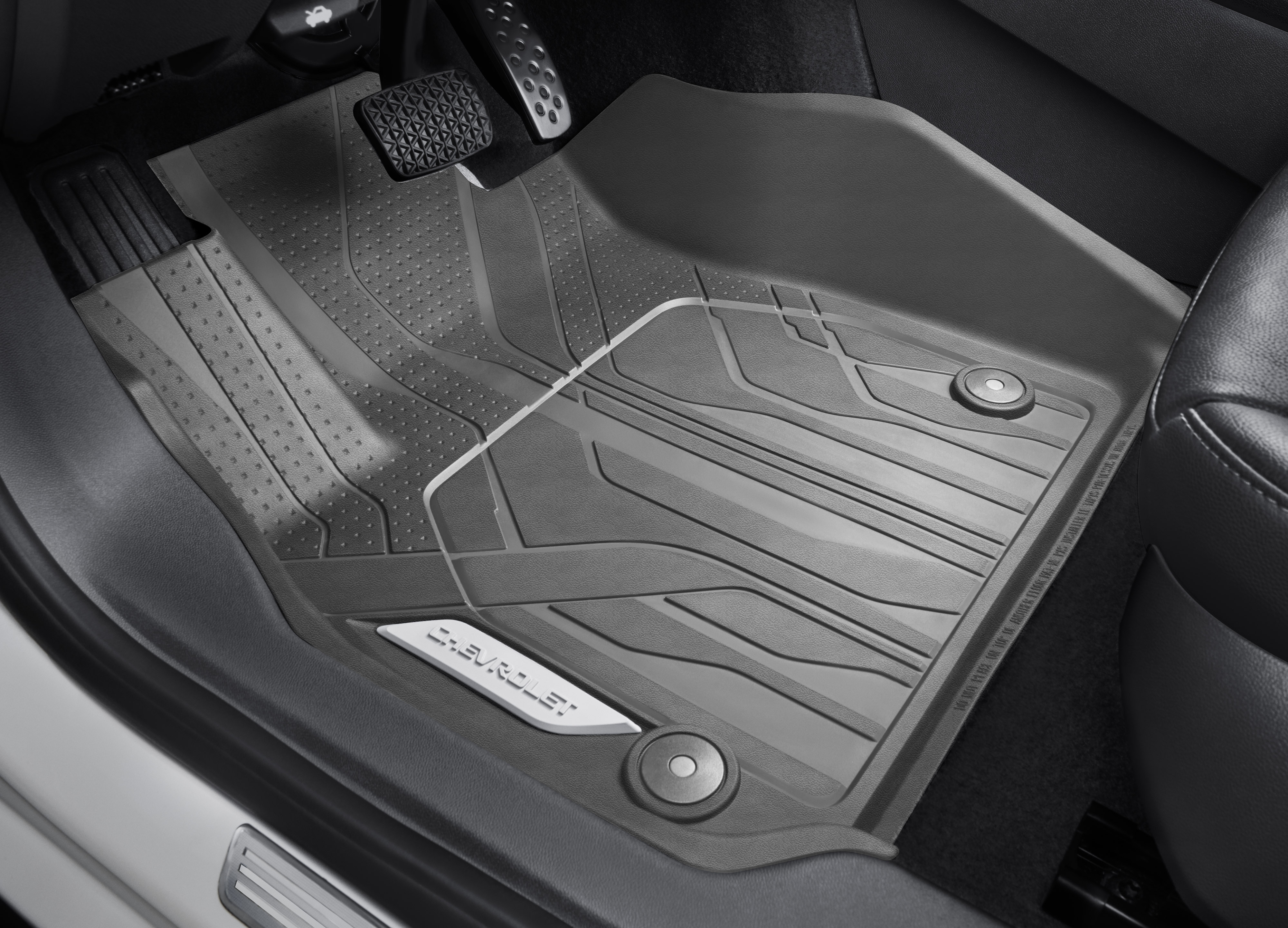 First-Row Premium All-Weather Floor Liners in Dark Atmosphere with Chevrolet Script