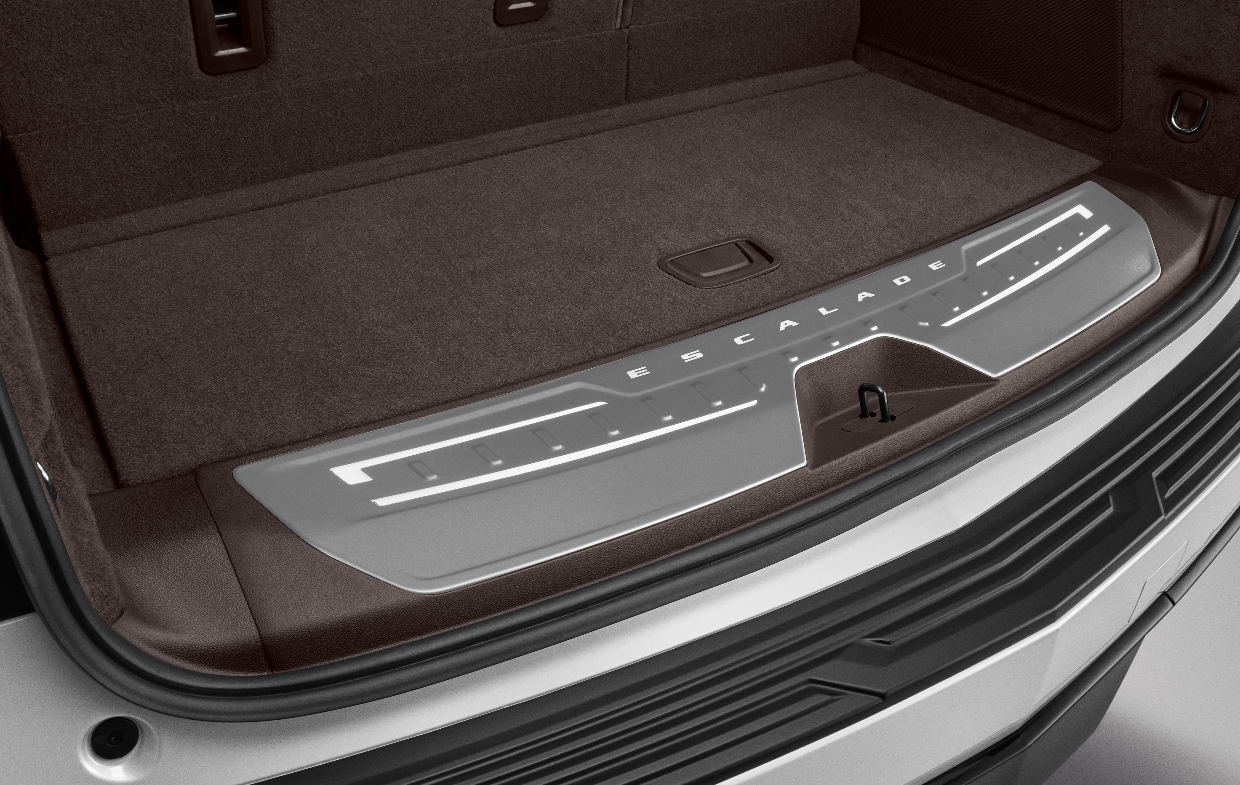 Illuminated Cargo Sill Plate in Very Dark Atmosphere with Escalade Script