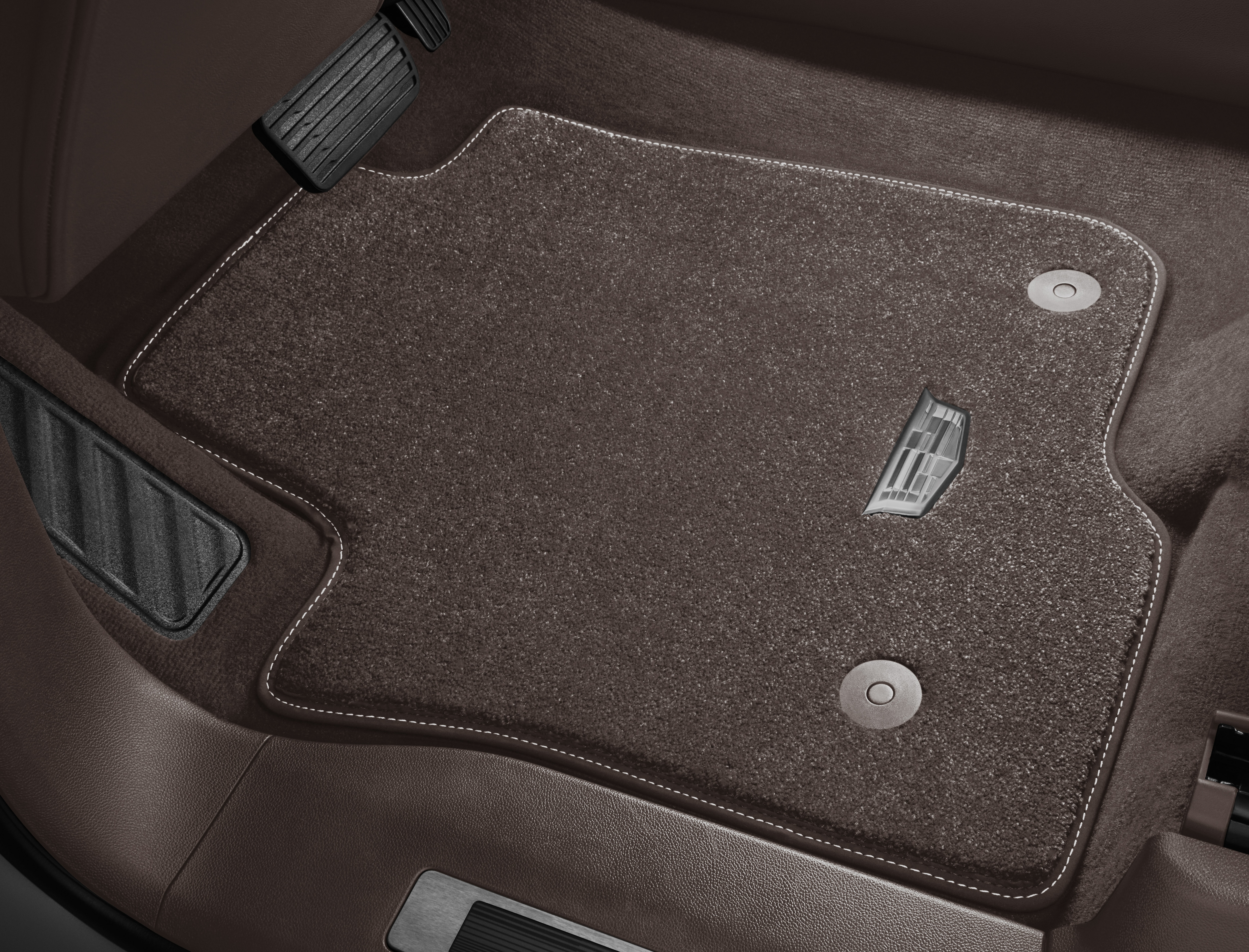 First- and Second-Row Premium Carpeted Floor Mats in Very Dark Atmosphere with Cadillac Logo