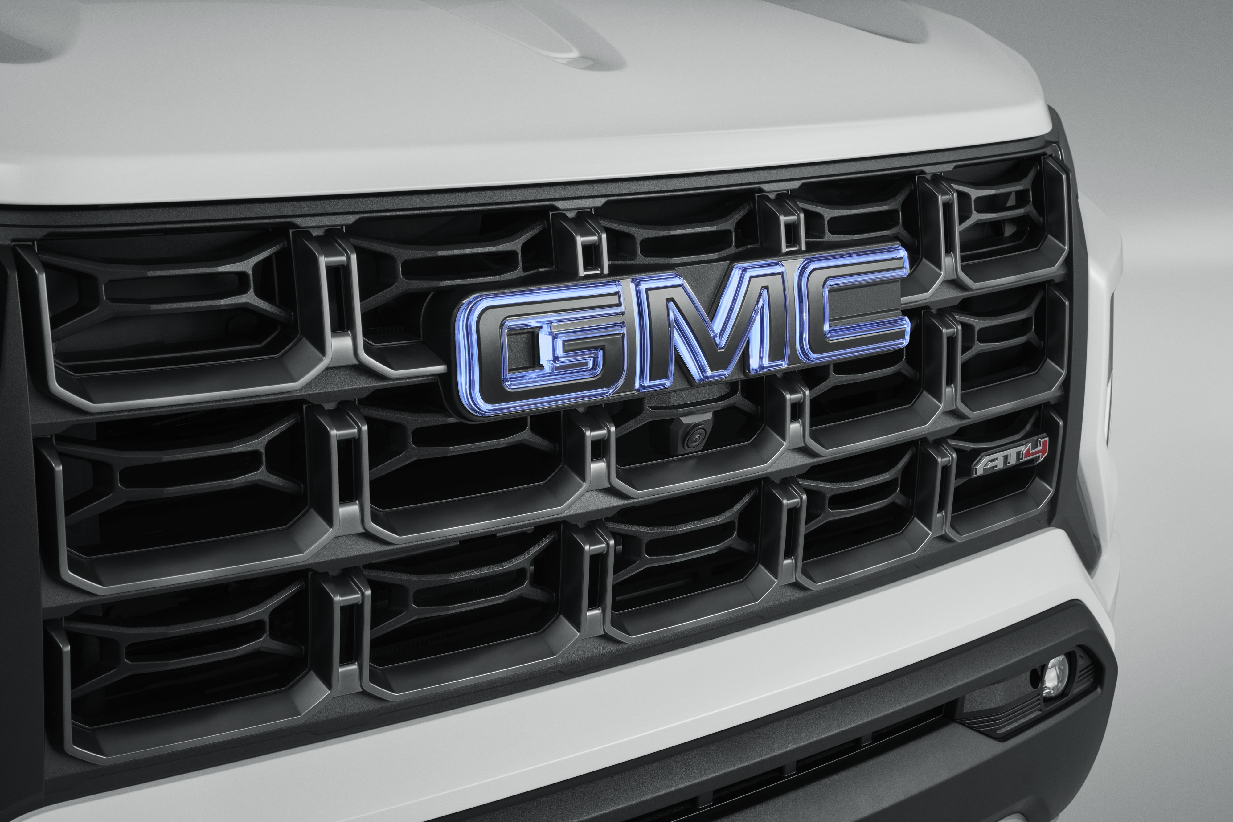 Front Illuminated and Rear Non-Illuminated GMC Emblems in Black