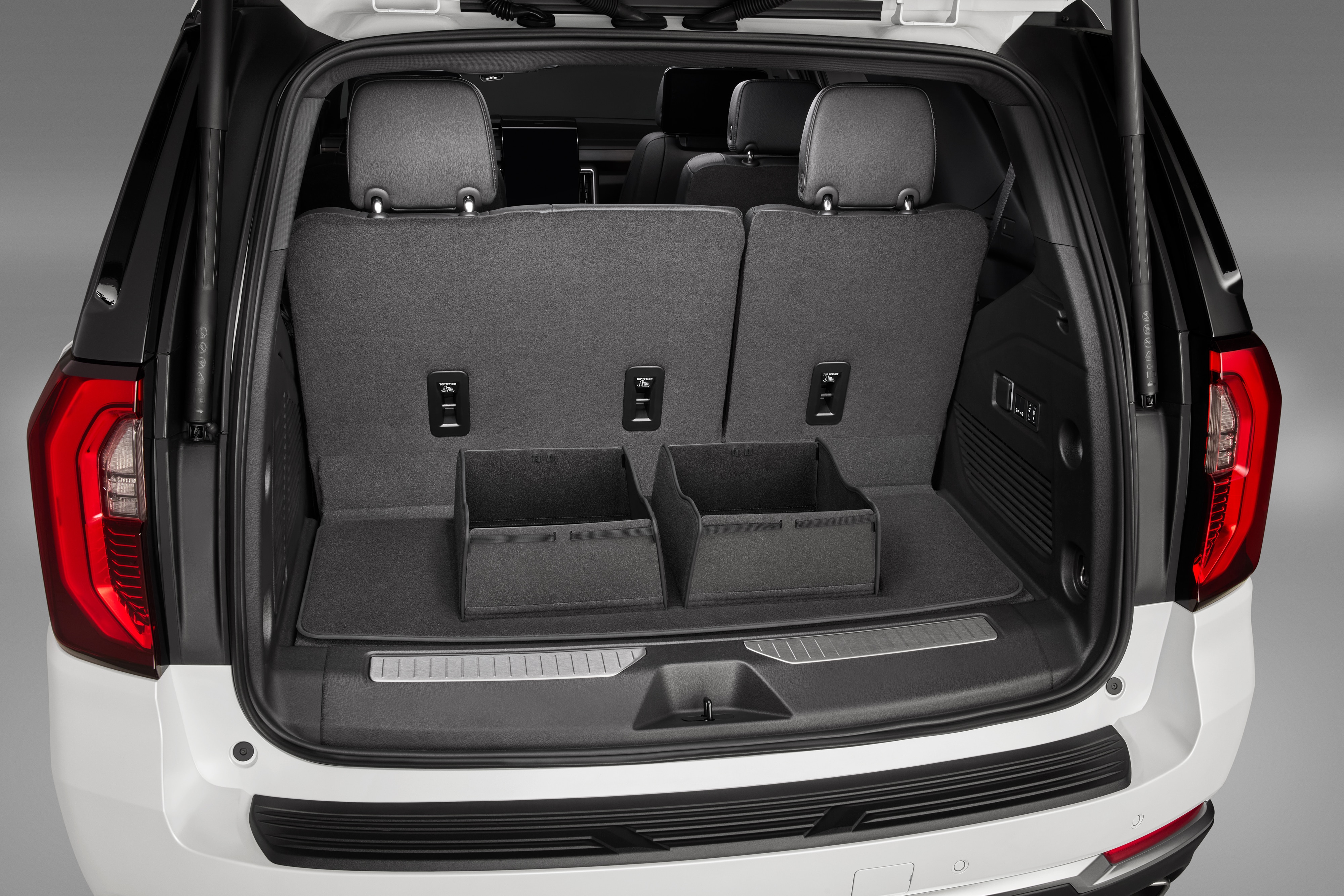 Premium Carpeted Cargo Area Mat in Jet Black with Integrated Cargo Bin