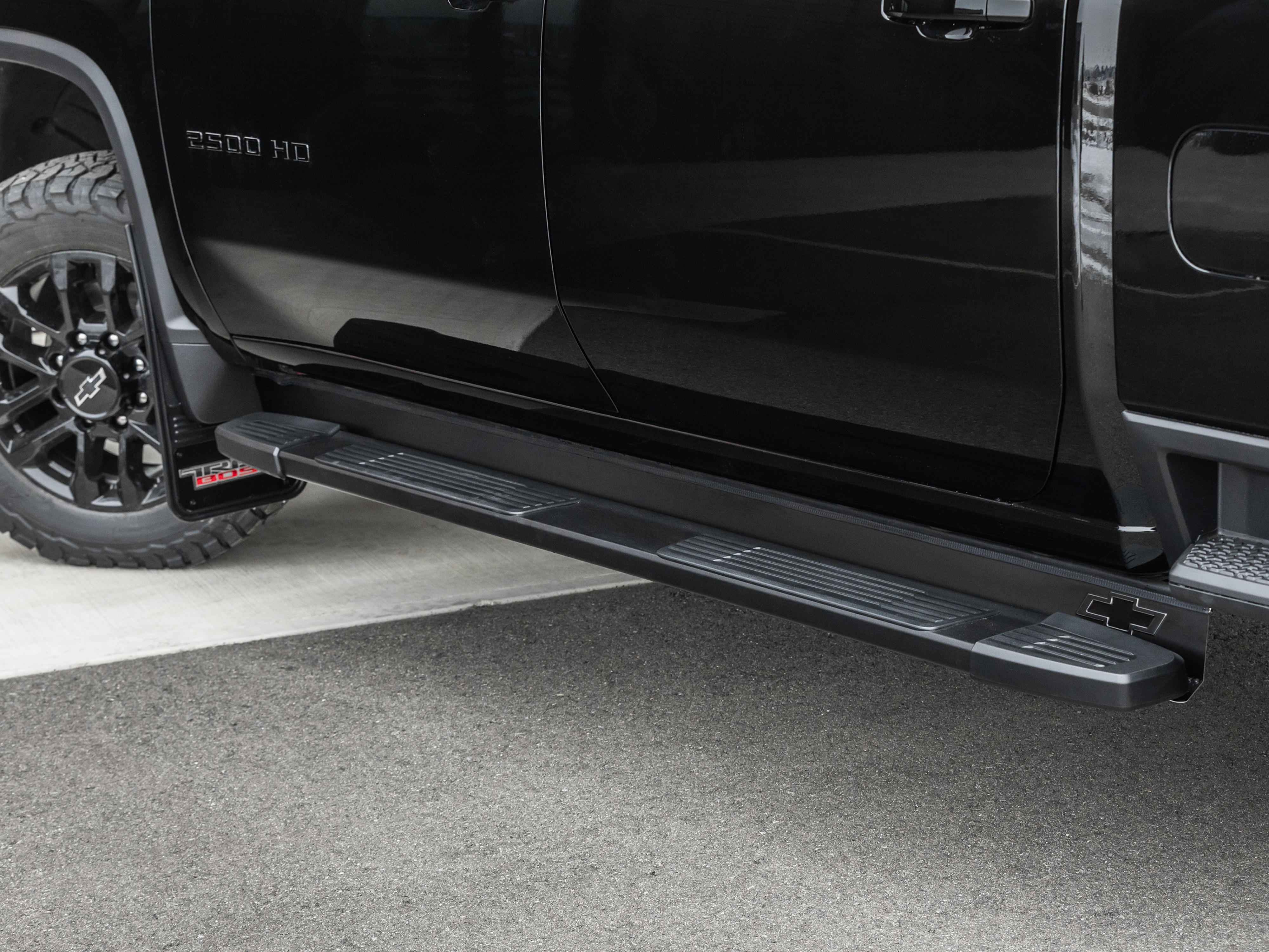 Assist Step Bar Fillers with Chevrolet Bowtie Logo in Black by Truck Hardware - Associated Accessories