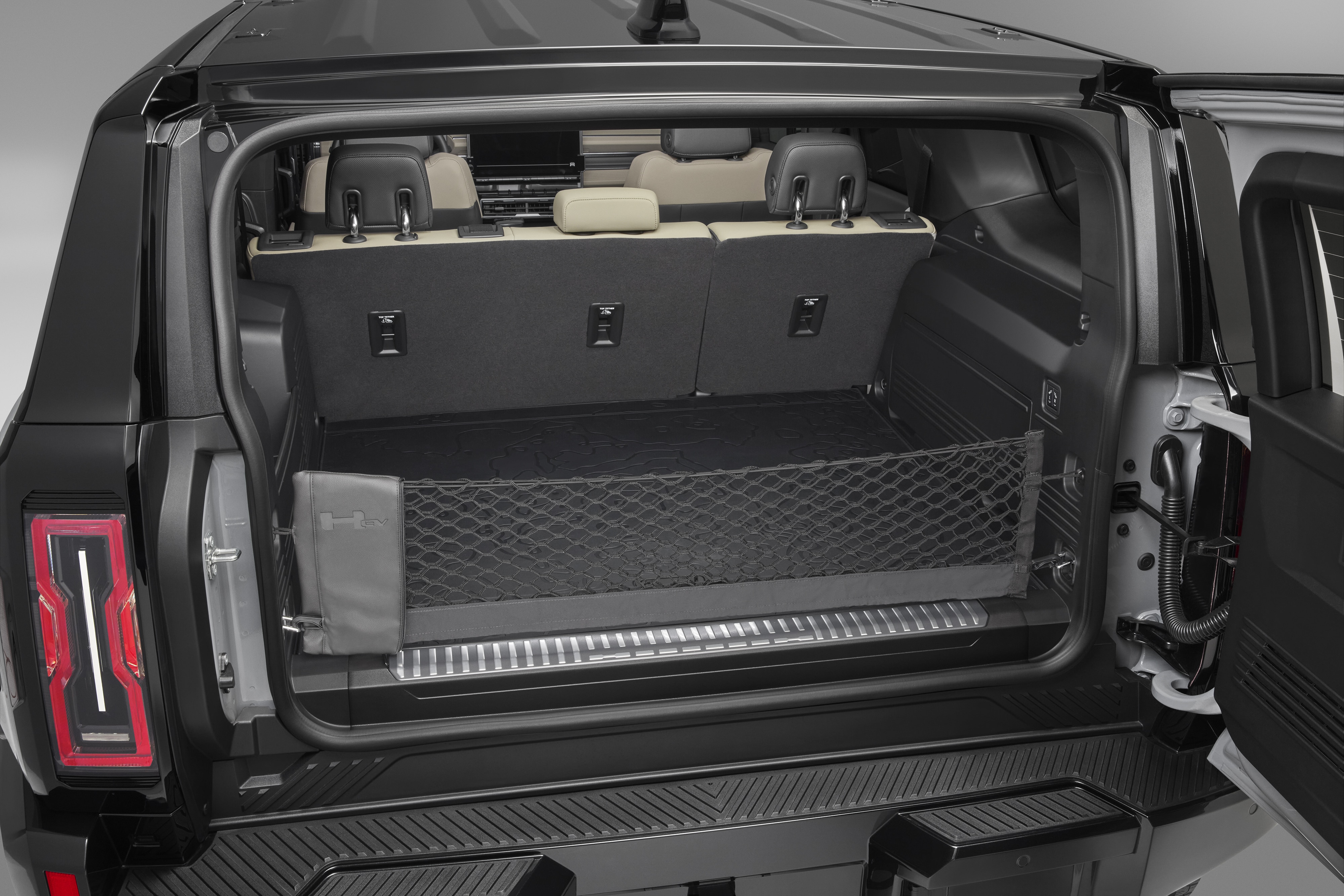 Vertical Cargo Net with Storage Bag featuring the GMC HUMMER EV Logo