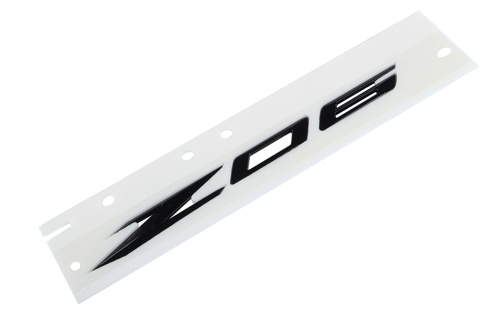 GM Genuine Parts Carbon Flash Metallic Body Side Rear Driver Side Marketing Package Name Plate